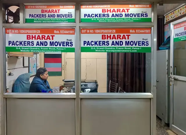 Bharat Packers and Movers office front at Grand Chandra Complex, Fraser Road, Patna, with GST number on the signboard